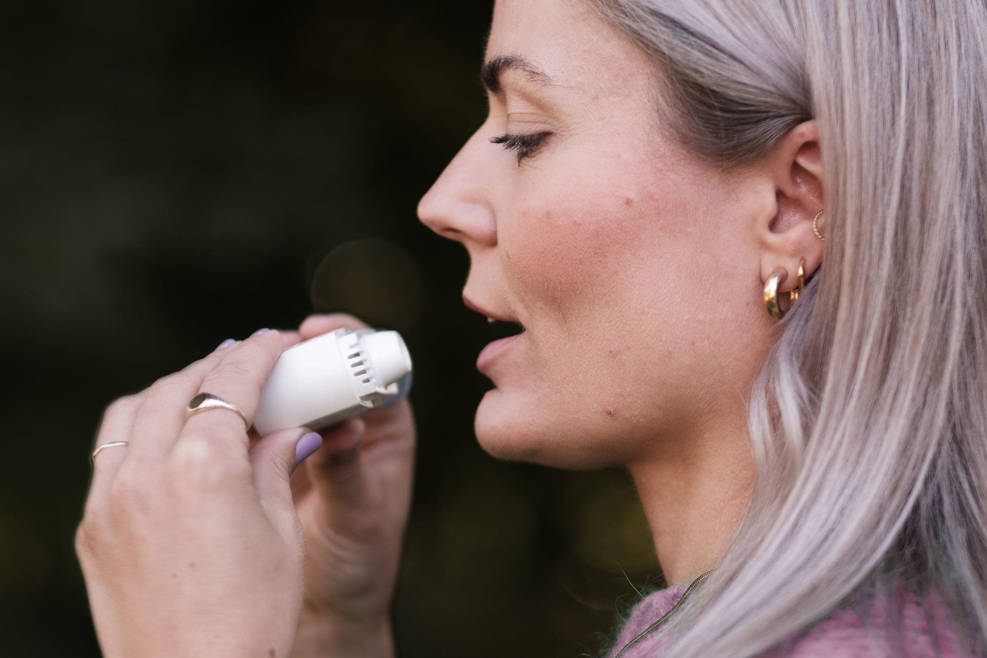 Illustration for Breathing problems: woman using an inhaler