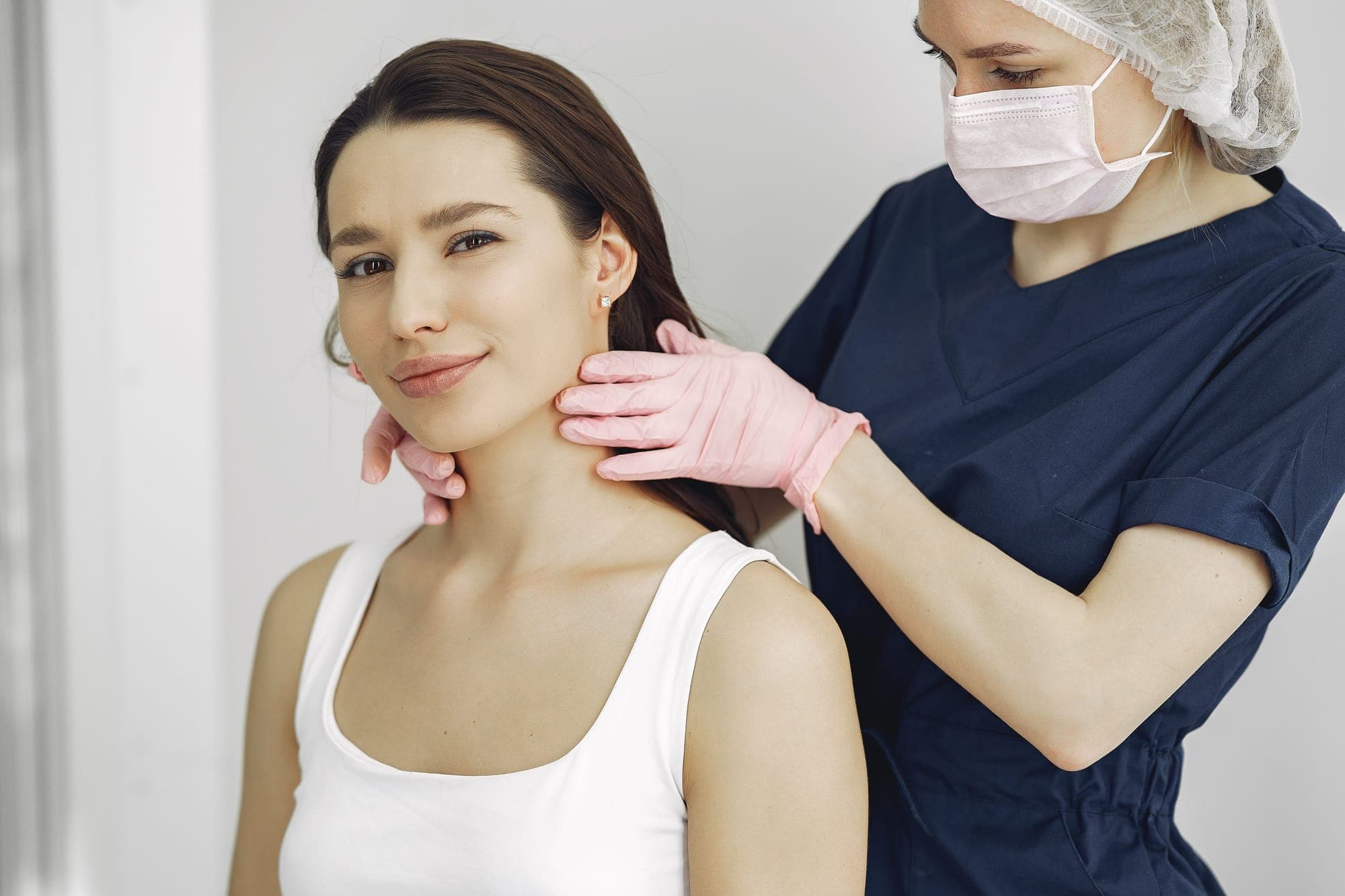 Illustration for Skin problems: dermatologist examining a woman’s skin